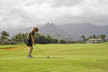 Woman playing golf in Hawaii