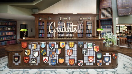 Hilton purchases Graduate Hotel brand feature image of Cambridge Check In Desk