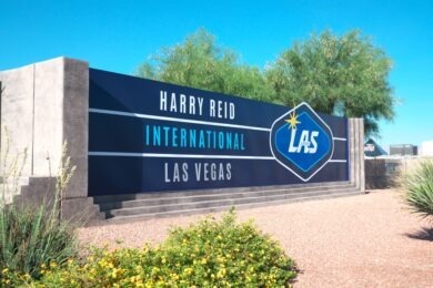 outdoor sign that reads "harry reid international airport"