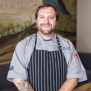 headshot of Corey Laub, executive chef at Merriweather Lakehouse Hotel
