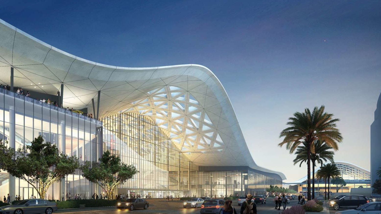 The exterior of Las Vegas Convention Center. The roof has a large wave in the center. The walls are all glass