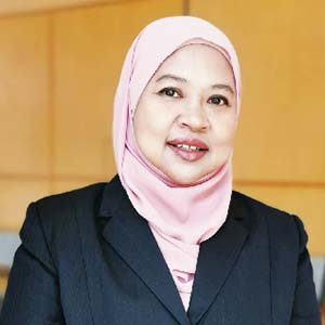A portrait of Haryati Md Haidar. She is a South Asian woman wearing a pink hijab and a black suit jacket