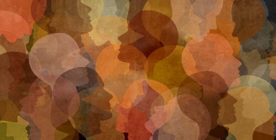 Overlaying silhouettes of faces in a diverse series of skin tones