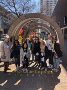 A group of Smart Meetings event attendees posing in the Bourbon District in Louisville