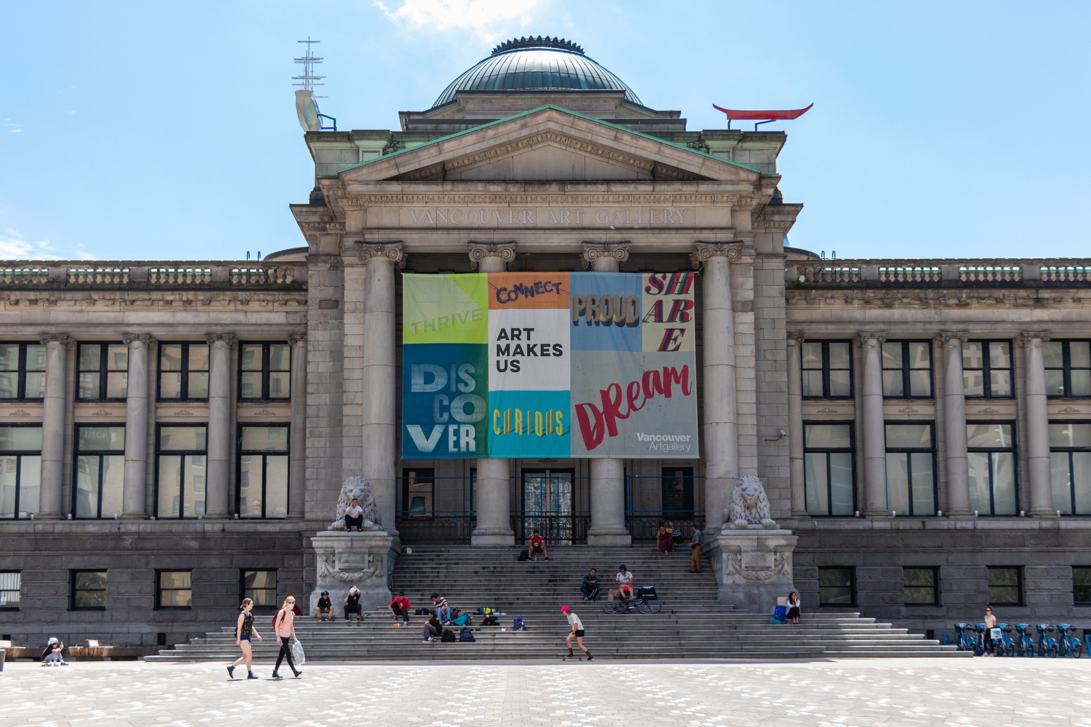 The Vancouver Art Gallery, a Neo-Classical building with people on the front steps.