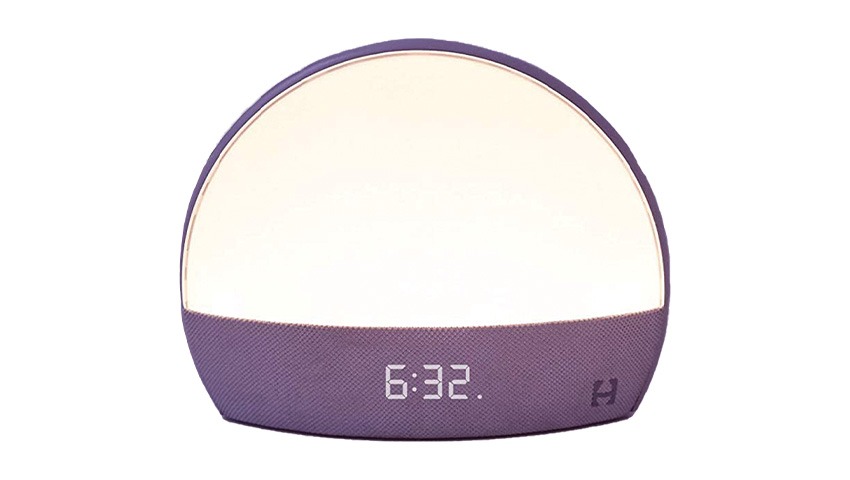 A multi-use alarm clock with a purple speaker, segmented numbers and a dome-shaped light