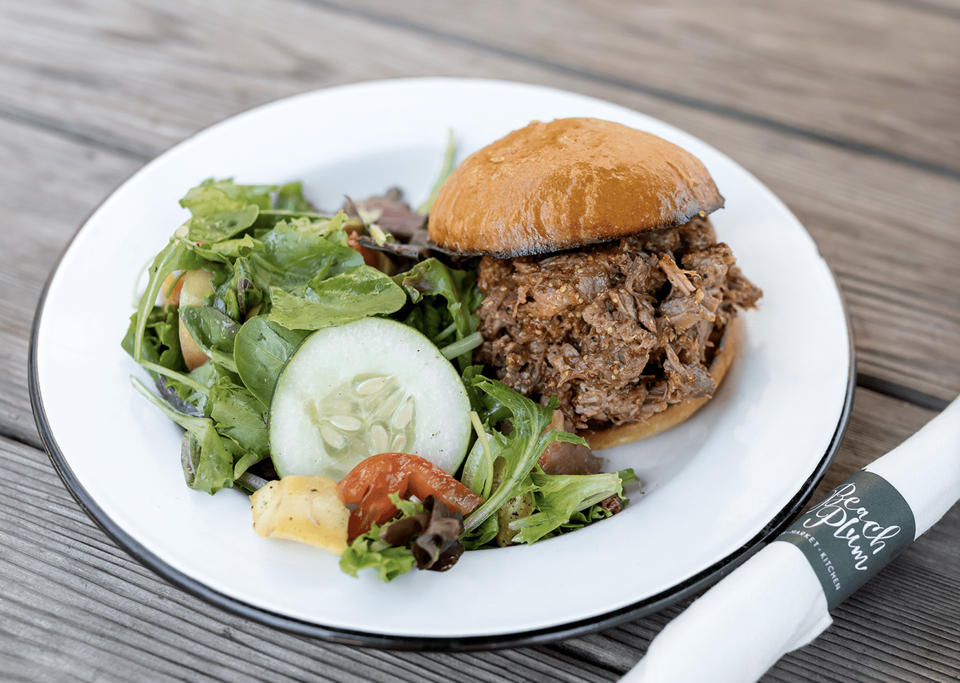 A meal from Beach Plum Farms. A sloppy joe with a spinach salad.