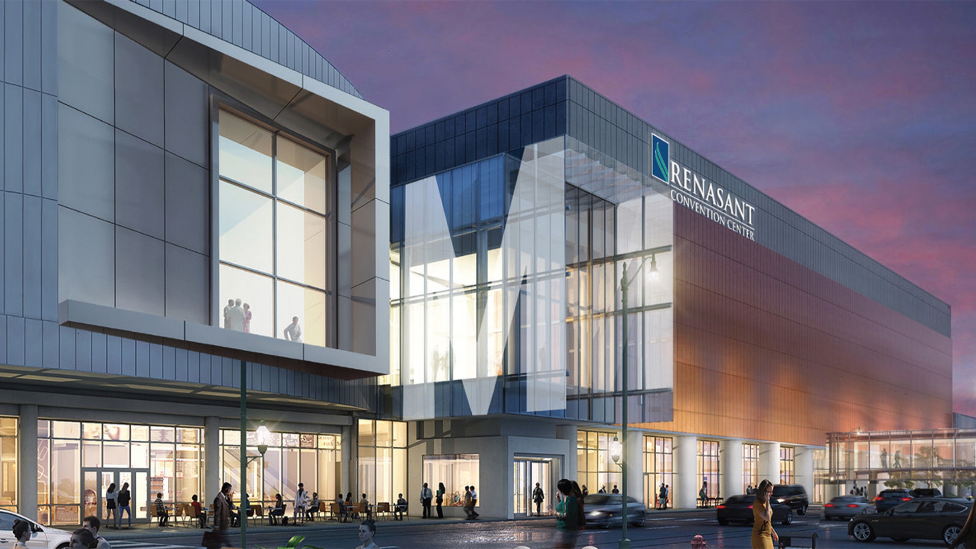 An exterior shot of the Renasant Convention Center. The building is completely glass in shades of bronze and blue.