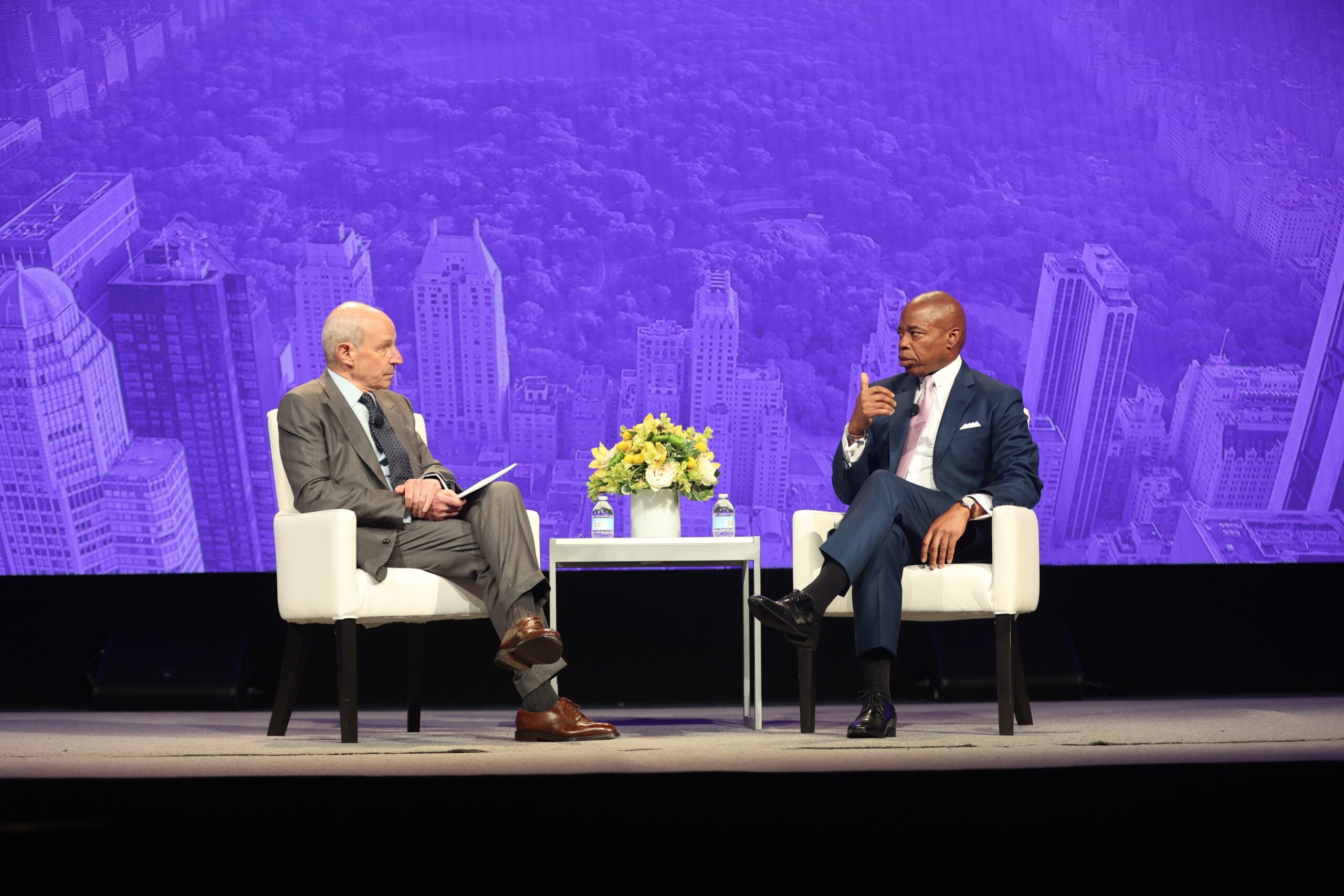 NYC Mayor Eric Adams sits opposite Jonathan M. Tisch onstage. Adams discusses what he is doing to make NYC the perfect hospitality destination.