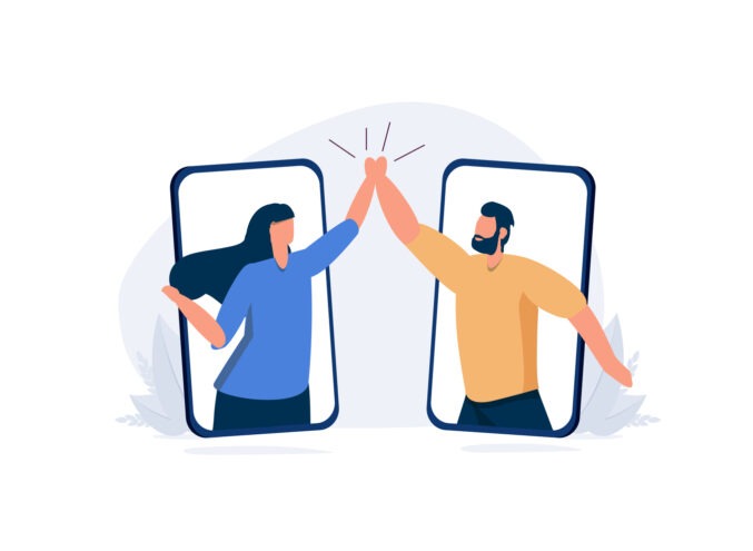 A vector image of two people high-fiving through smart phones.
