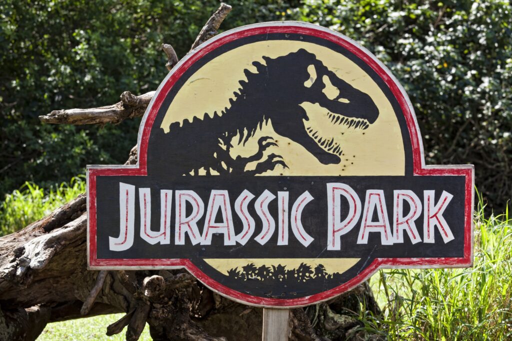 A sign with the Jurassic Park logo.
