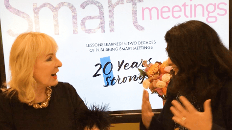 two women smiling and talking