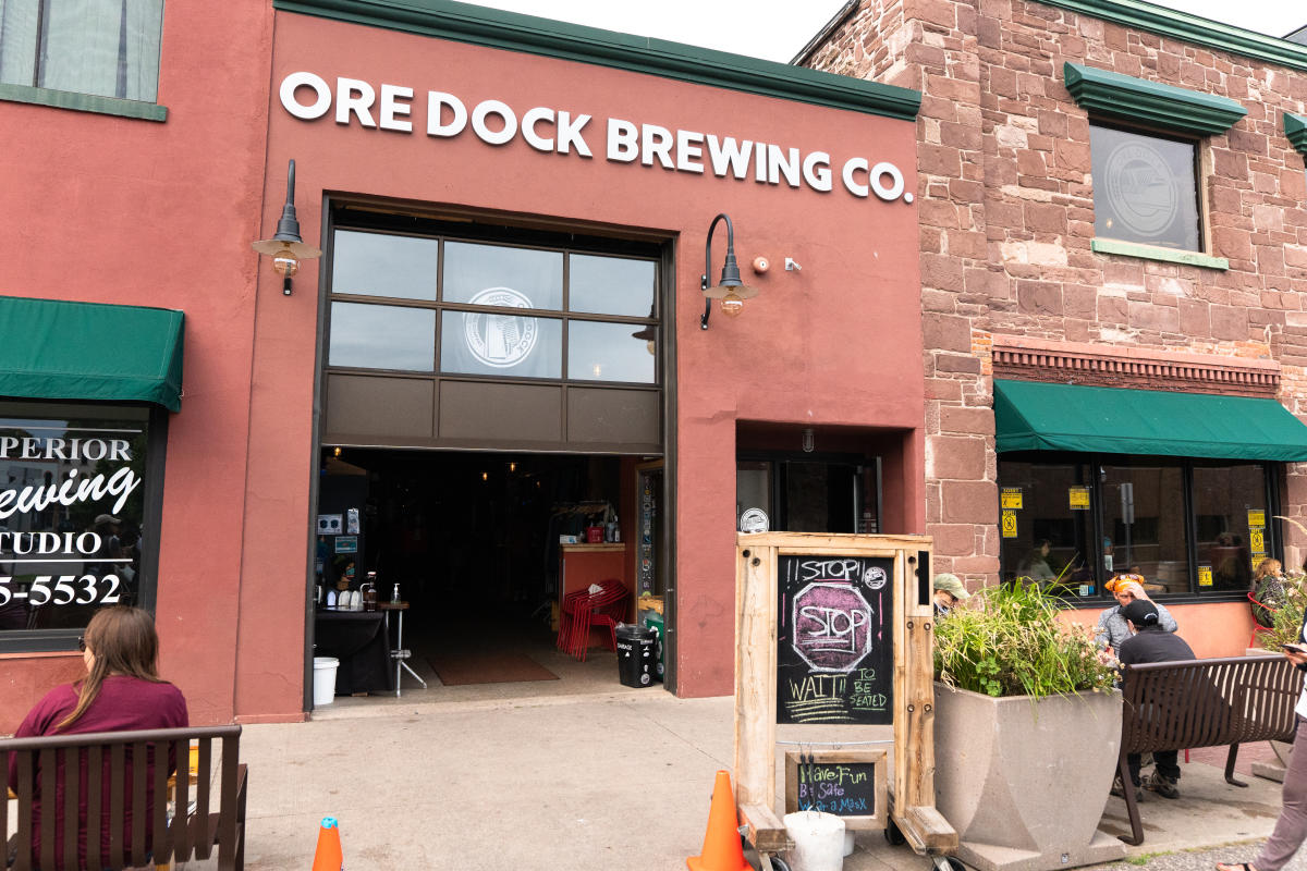 Ore Dock Brewing Company, a small red building with a garage door entrance.