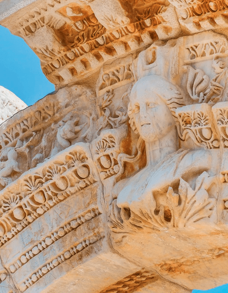 The bust of a woman carved into a marble arch in Kusadasi.