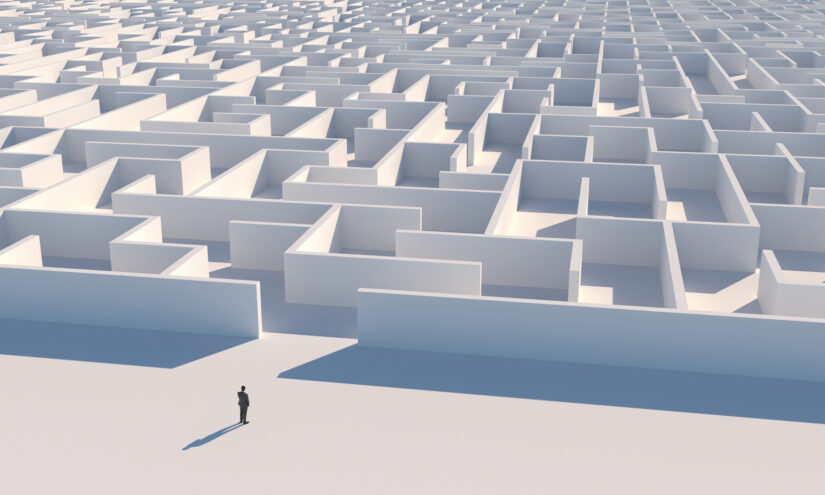 businessman looking at the entrance of a maze, representing navigating covid during business meetings