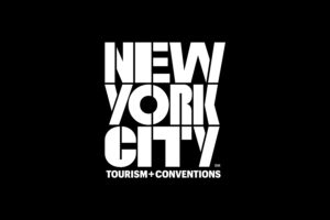 New York City Tourism + Conventions logo white type with black stacked letters.