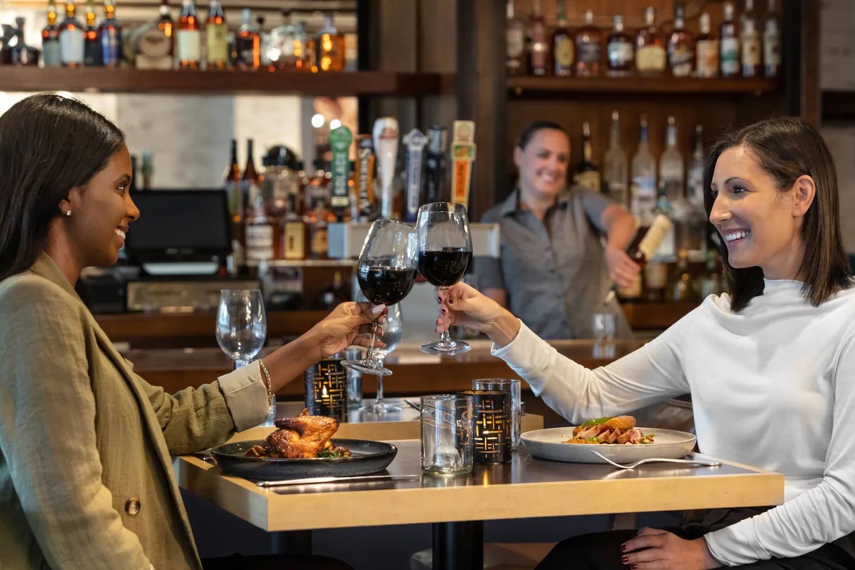 two women drinking wine at the alexandrian in virginia