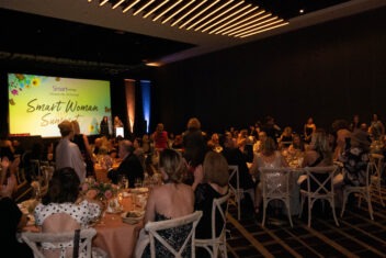 room full of people at smart woman summit event