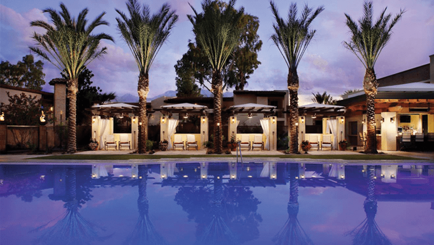 pool and palm trees at outdoor space at omni tucson national resort