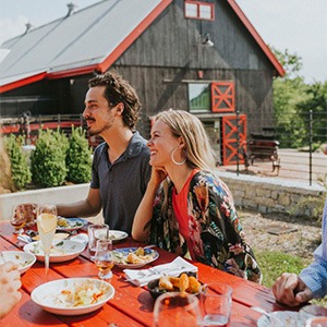 people sitting at a table at Barn 8 Farm Restaurant and Bourbon Bar at hermitage farm