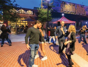 people dancing in the street in Santa Ana