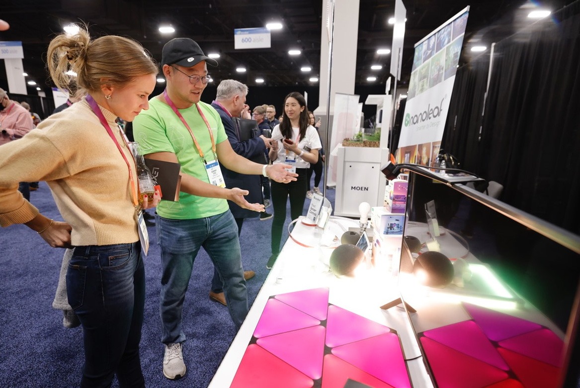 attendees at the consumer electronics show looking at new technology
