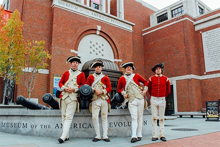 british reenactors standing in front of museum of the american revolution