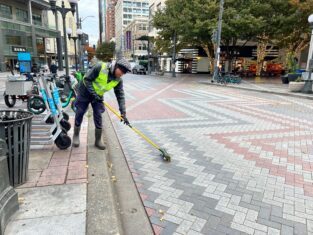 man cleaning up streets in seattle
