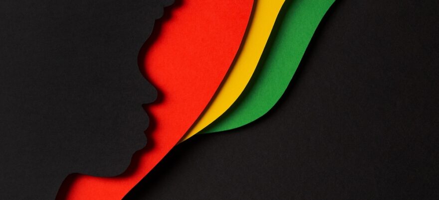 Black History Month color background with Aastract geometric red, yellow, green color background shapes and black paper cut silhouette of face profile