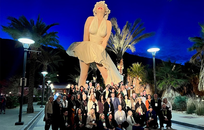 people posing for image in front of marilyn monroe statue in palm springs, california