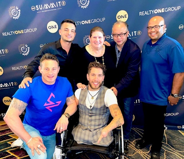jaki baskow and nick santonastasso and four other men posing for picture