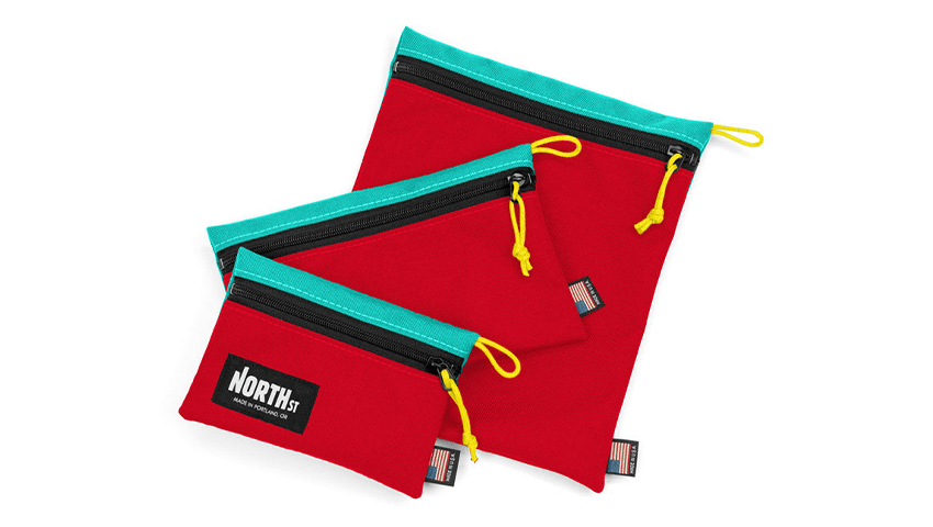 three red zipper bags