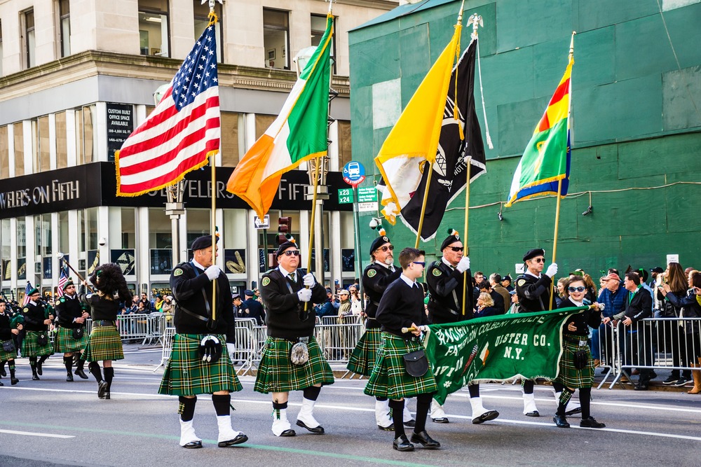 Marchers with flags dressed in kilts march in the St Patrick's Day Parade on on 5th Ave in New York City
