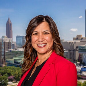 charlene lopez wearing red sport coat and black dress shirt