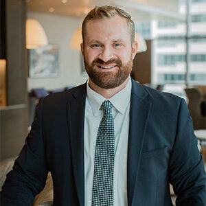 Chris Connelly wearing blue suit