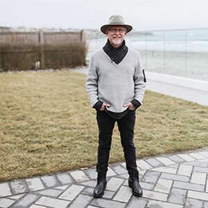 doug klein wearing grey wide-brimmed hat and grey sweater