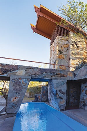 pool sitting under awning in hotel