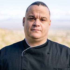 man wearing black chef shirt