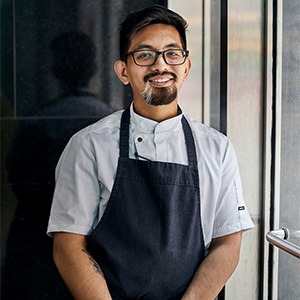 man wearing apron and white chef shirt