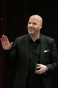 man wearing black dress shirt and black sport coat