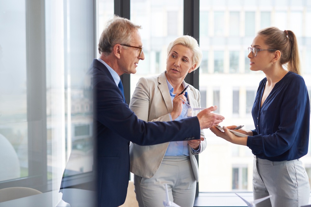 three businesspeople talking