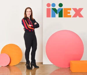 Carina Bauer with new IMEX logo