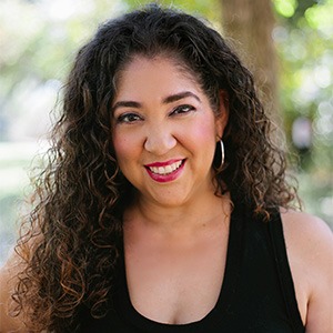 woman smiling, wearing black tank top