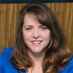 woman smiling, wearing blue shirt