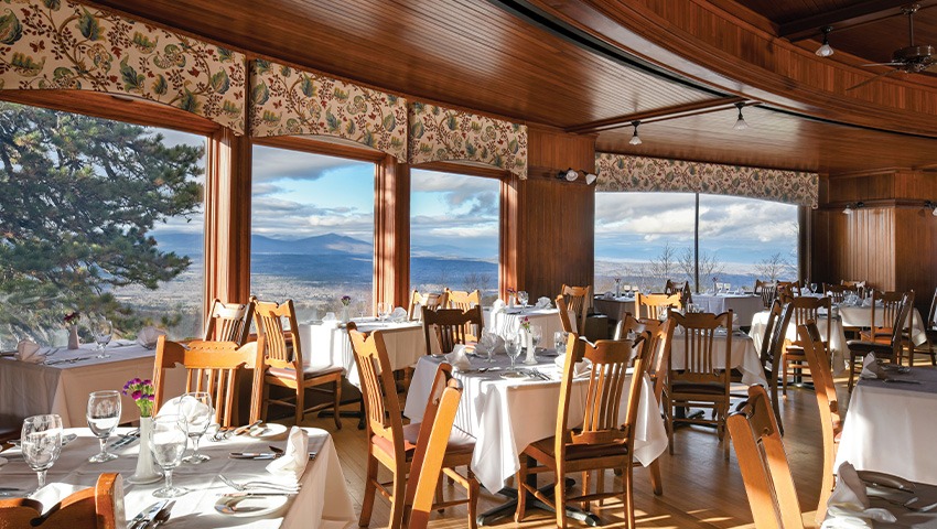 dining room, mountains in background outside window