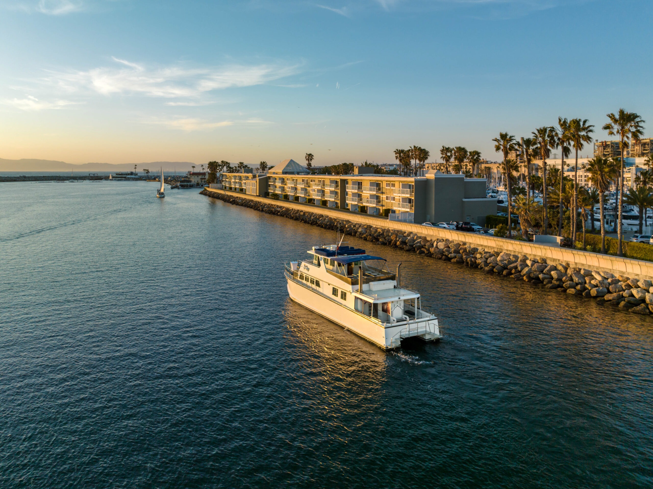 aerial shot of catamaran next to hotel