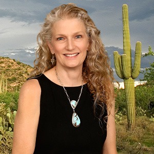 woman in black sleeveless shirt smiling