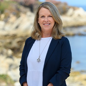 woman in blue sweater smiling