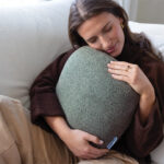 woman hugging pillow