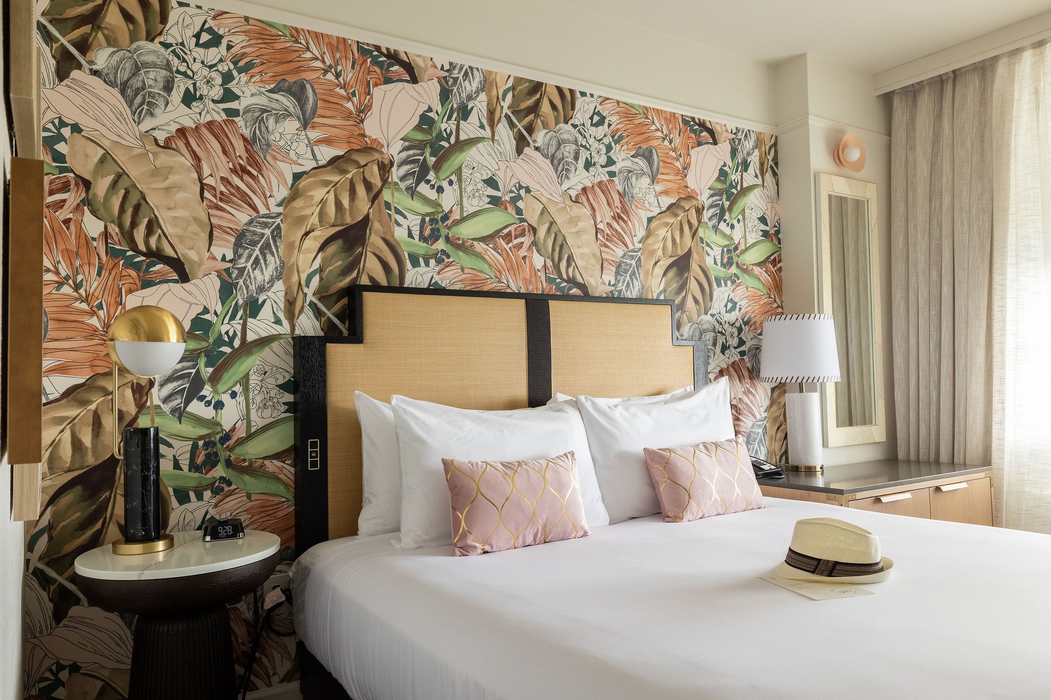 guest room with floral walls 